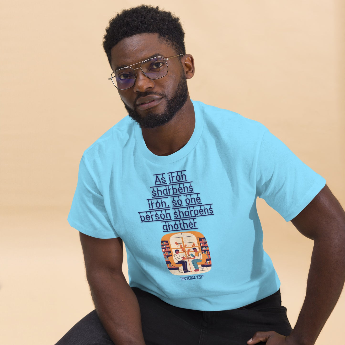 Man wearing light blue Tees of Worship t-shirt with As iron sharpens iron Bible verse graphic