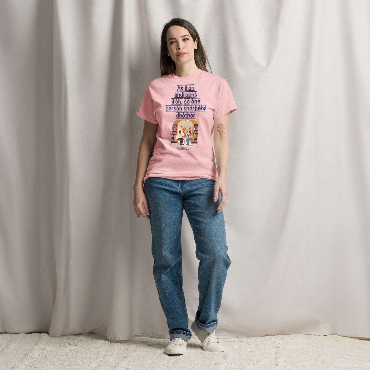 Tees of Worship pink T-Shirt with As iron sharpens iron text and graphic, worn by a woman with jeans