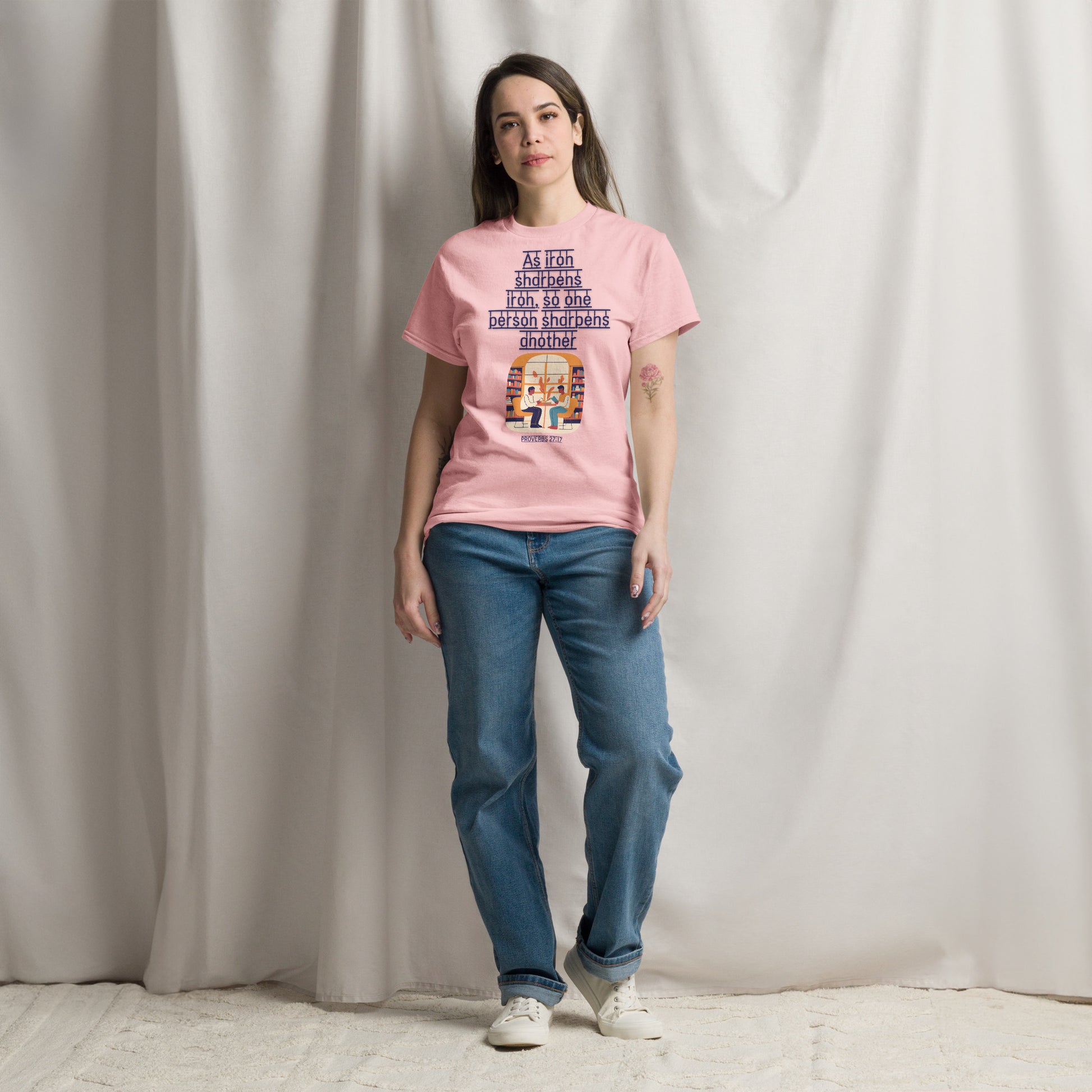 Tees of Worship pink T-Shirt with As iron sharpens iron text and graphic, worn by a woman with jeans