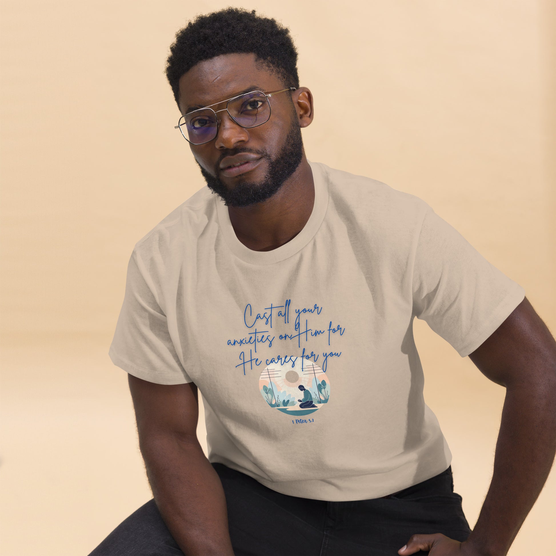 Tees of Worship beige t-shirt with inspirational he cares for you message worn by man with glasses