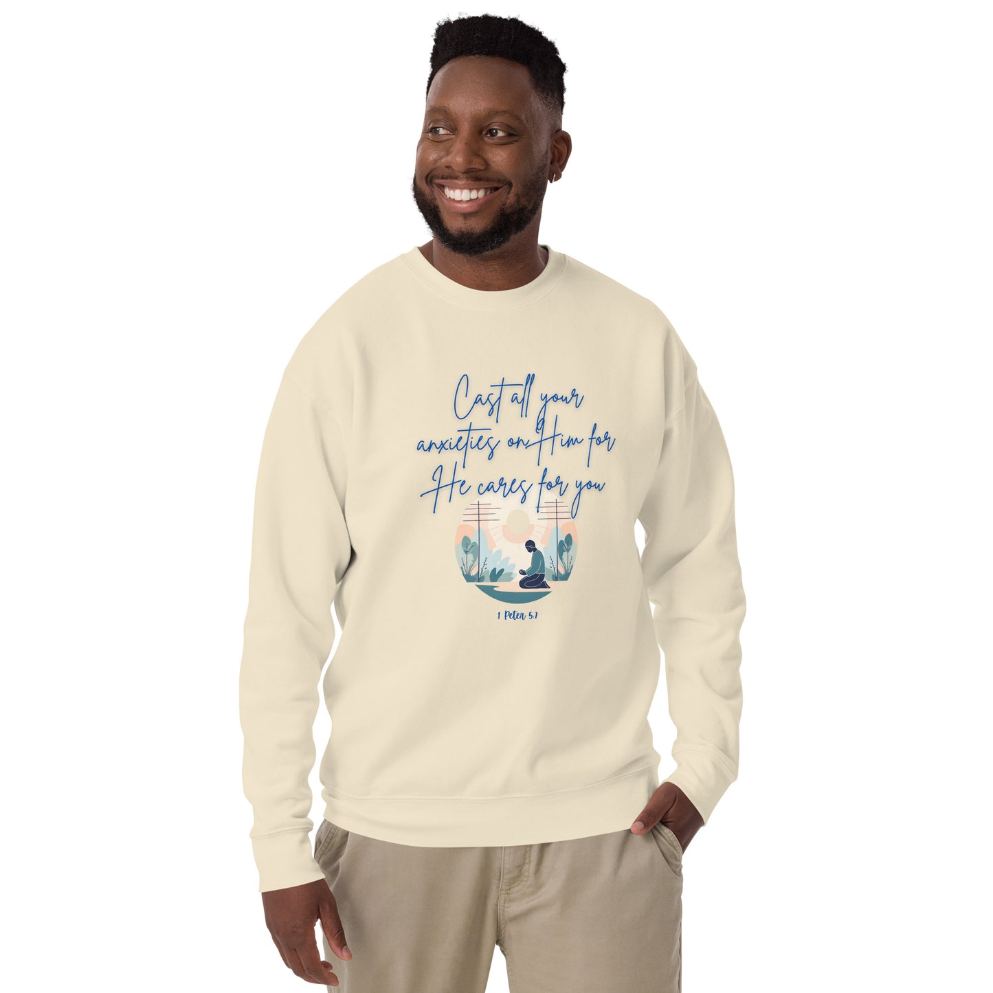 Man wearing beige sweatshirt with blue text saying he cares for you and desert illustration