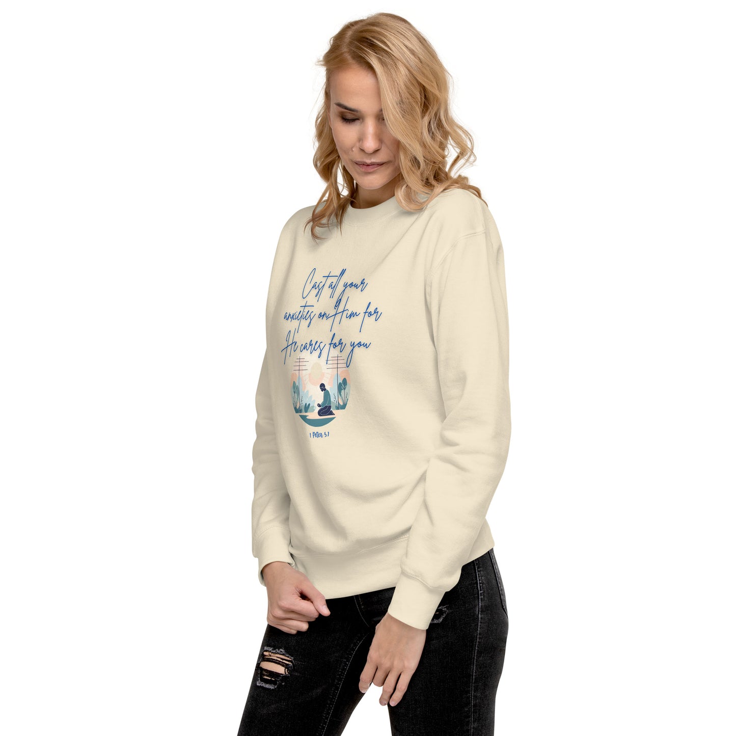 Cream sweatshirt from Tees of Worship with blue text and design saying he cares for you