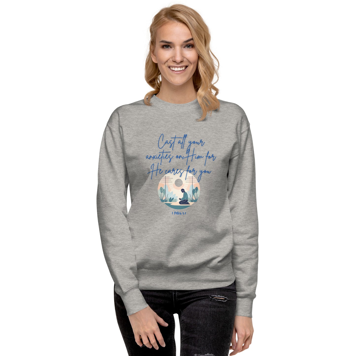 Gray sweatshirt with blue text 'he cares for you' and peaceful nature design worn by smiling woman