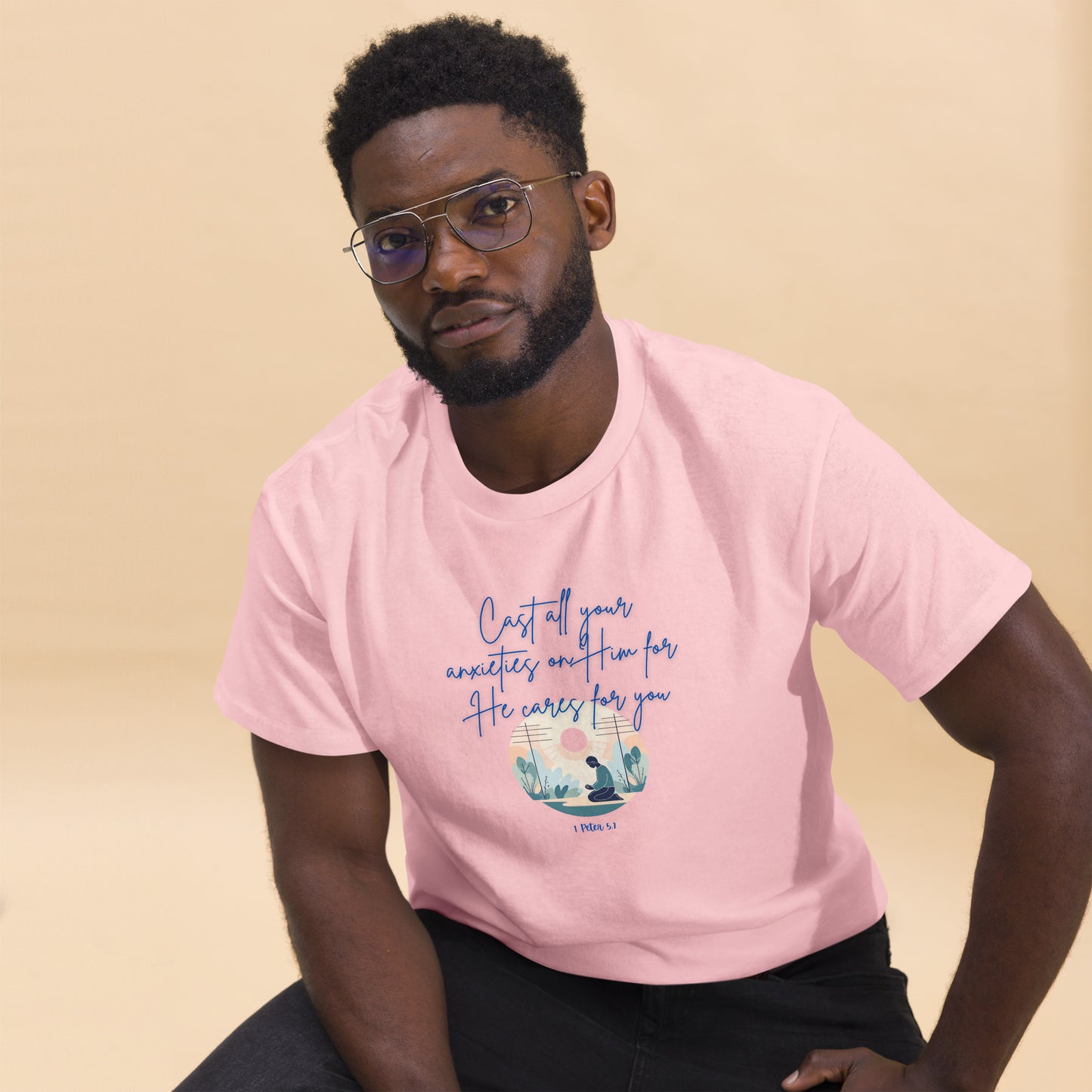 Tees of Worship pink t-shirt with he cares for you text and nature design worn by man