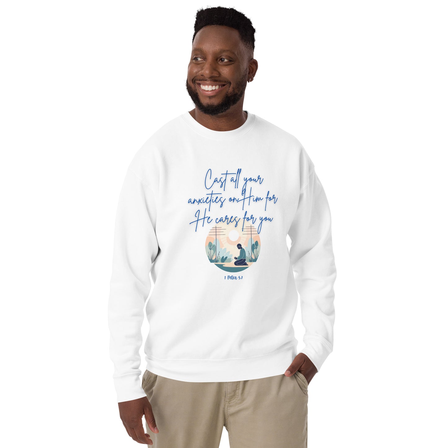 White sweatshirt with blue text saying he cares for you and scripture verse worn by smiling man