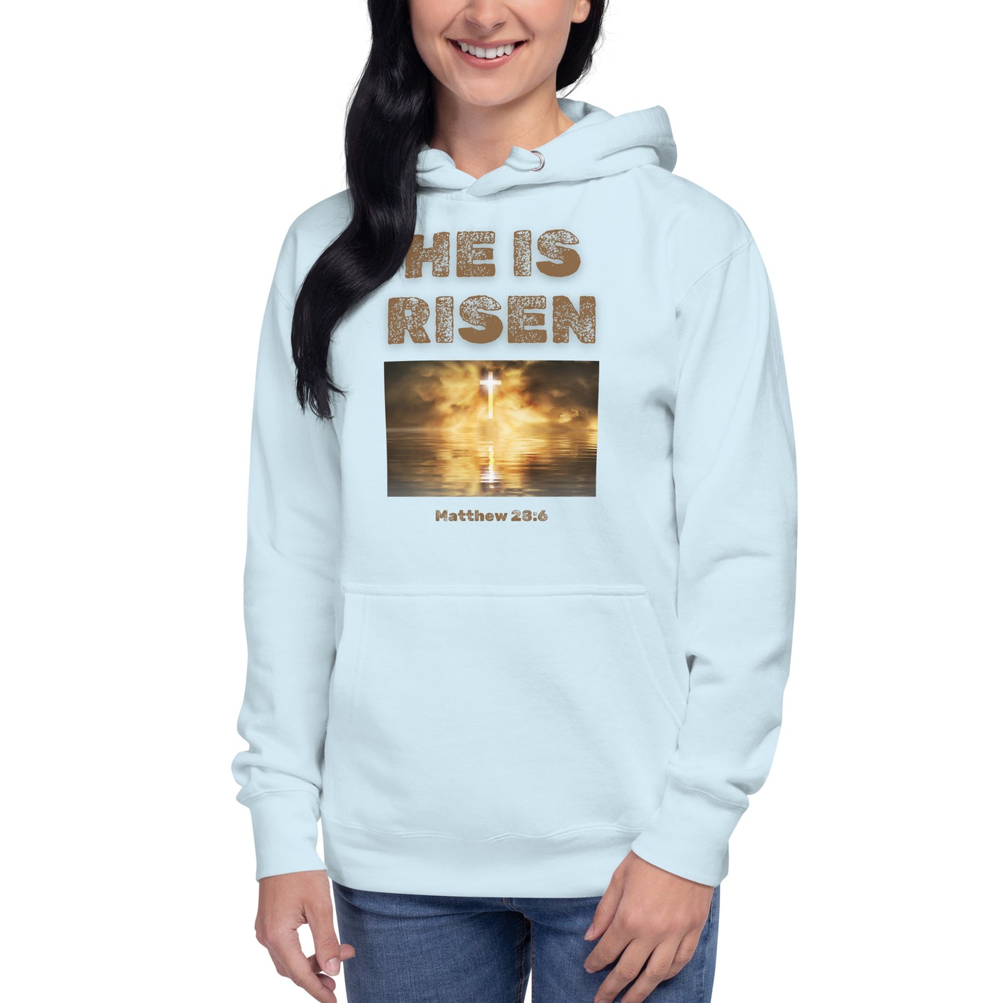Tees of Worship light blue hoodie with He is Risen text and glowing cross design on front