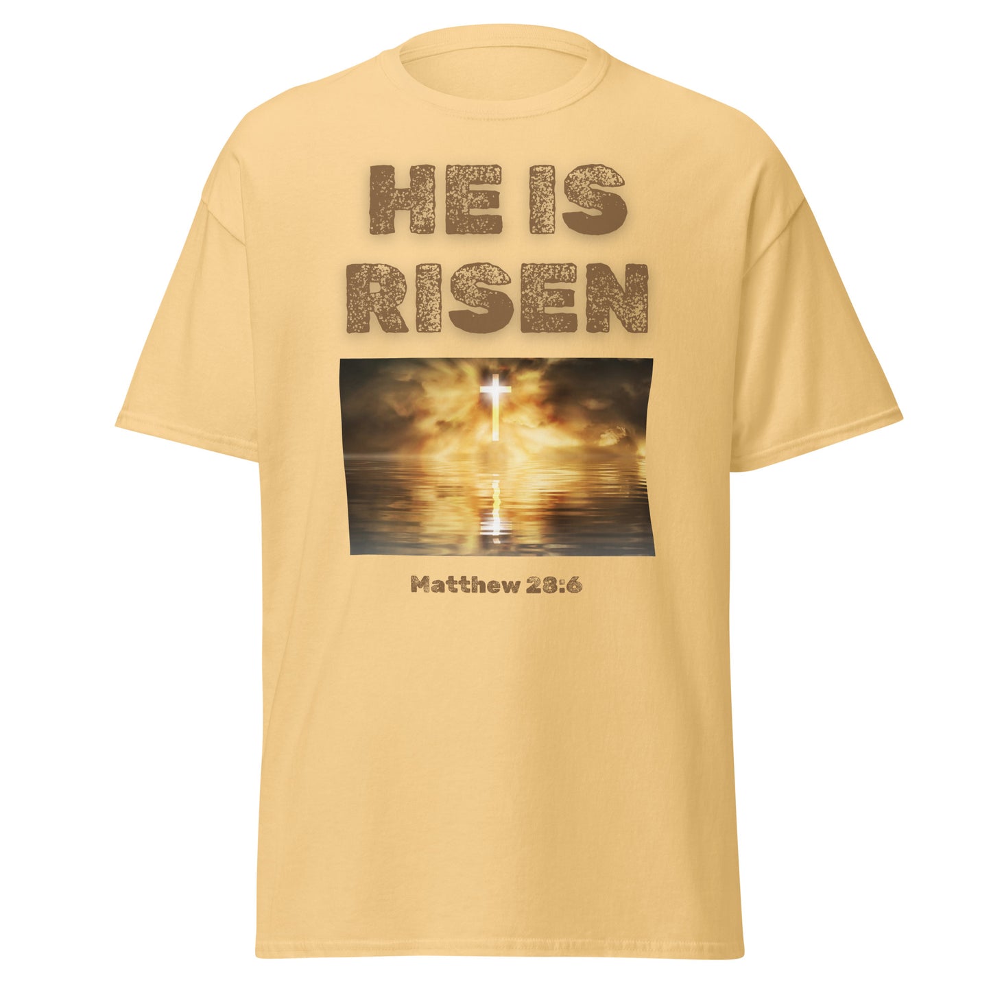 He Is Risen T-shirt by Tees of Worship with a glowing cross and Matthew 28:6 scripture on beige fabric