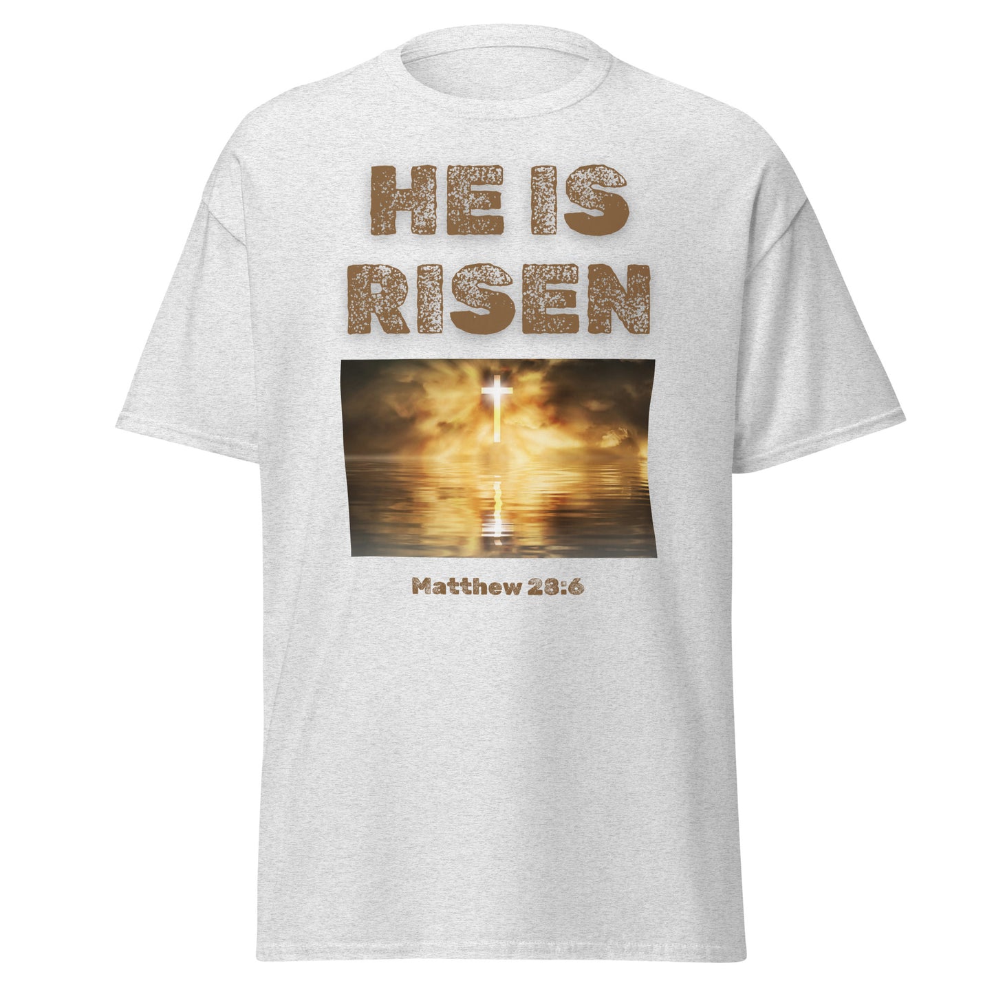 White He Is Risen T-shirt with glowing cross and Matthew 28:6 scripture from Tees of Worship