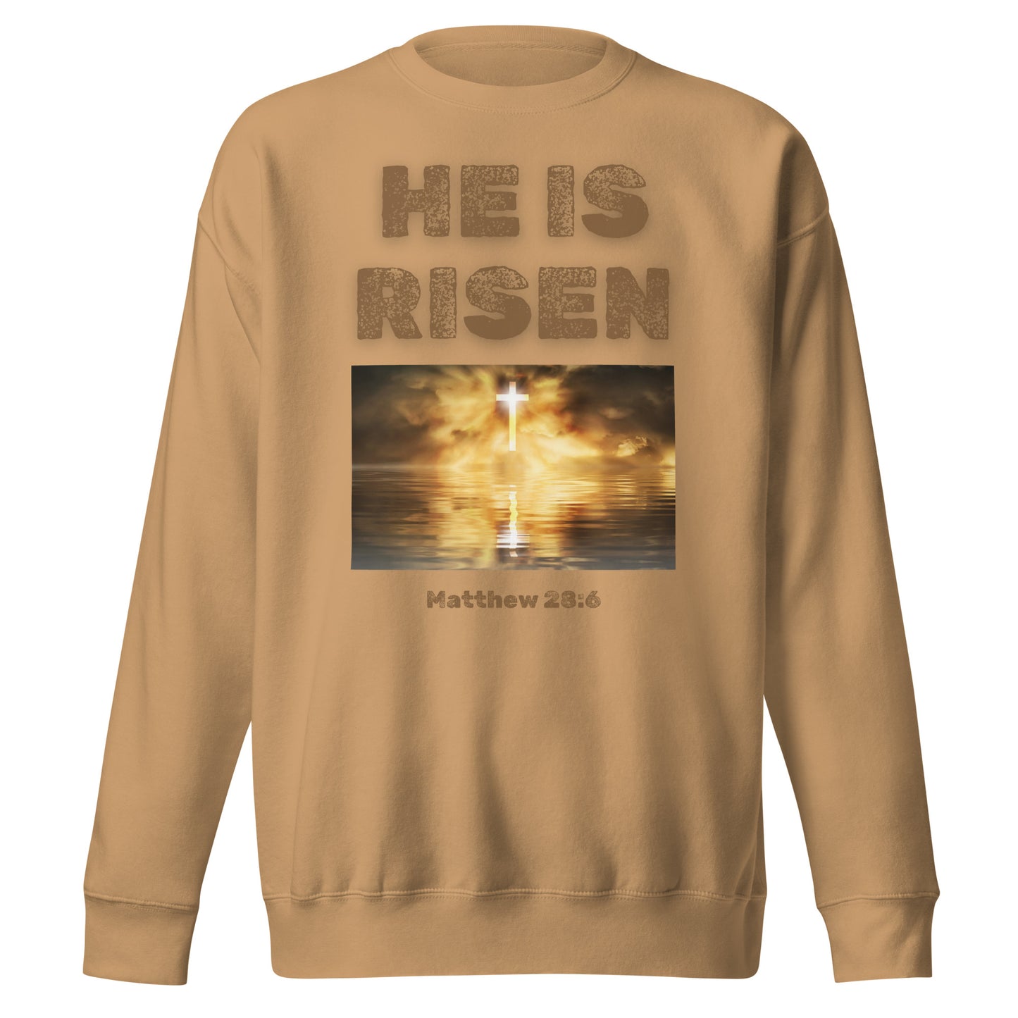 He Is Risen sweatshirt in tan with a glowing cross and Matthew 28:6 scripture design