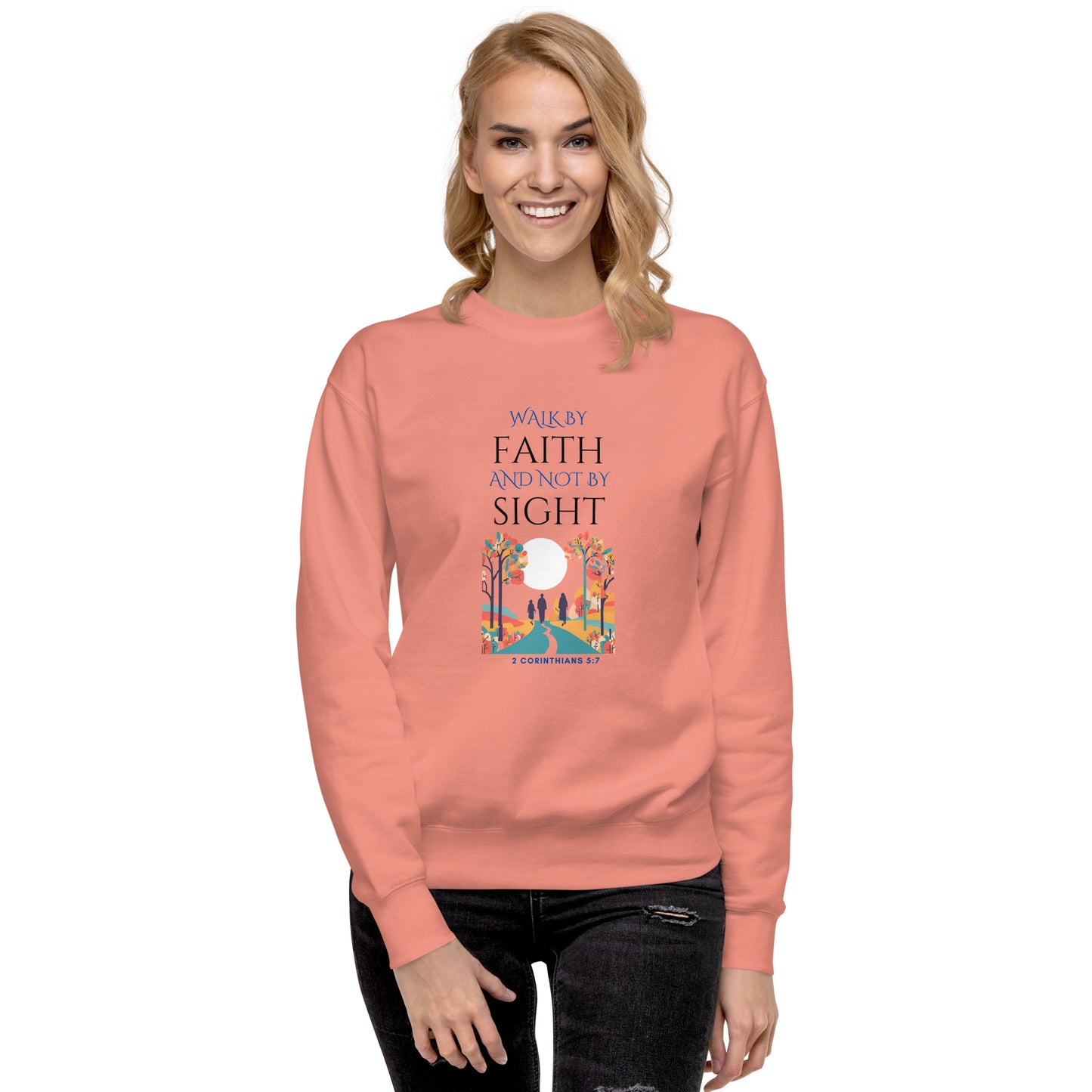 Woman wearing coral sweatshirt with Walk by faith and not by sight inspirational quote and colorful nature design
